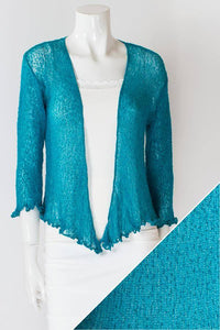 Women's short lightweight 3/4 sleeve sheer shrug.