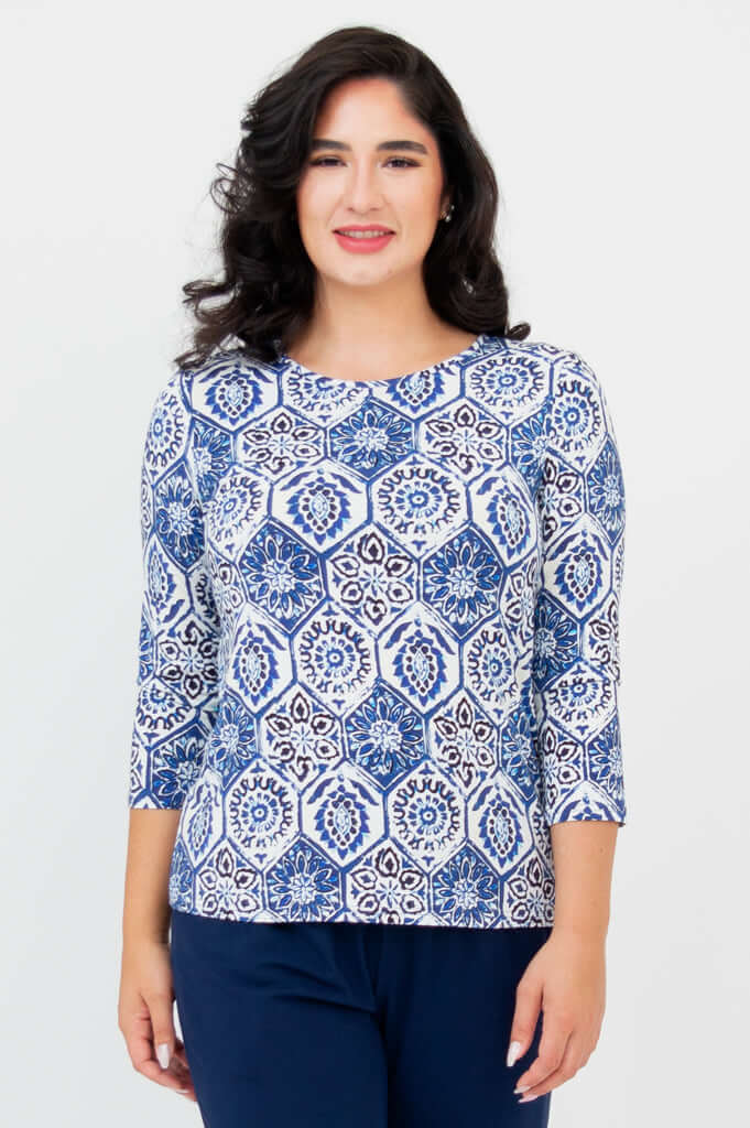 Front view of woman wearing blue mosaic 3/4 sleeve fitted tee