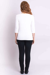 Back view of woman in white V-neck 3/4 sleeve bamboo top