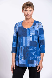 Front view close-up of model in blue patchwork 3/4 sleeve top