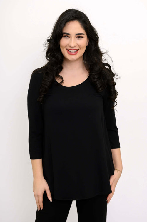 Woman wearing a black 3/4 sleeve bamboo top, front view, smiling