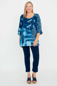 Full body shot of woman in blue 3/4 sleeve blouse and navy pants, front view