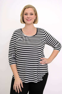 Front view of model wearing black and white striped 3/4 sleeve top