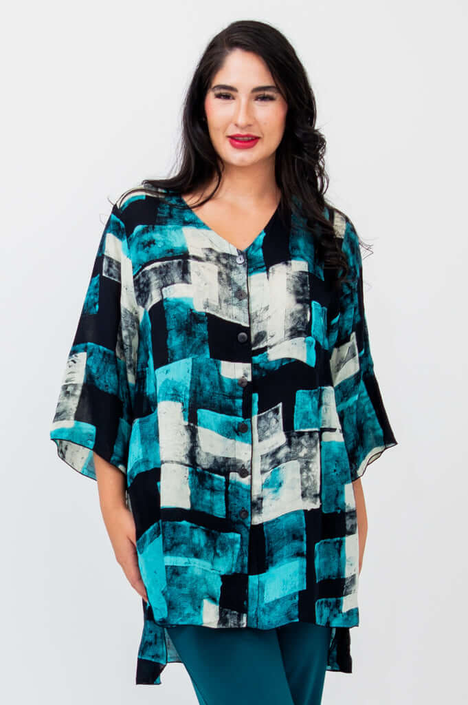 Front view of woman wearing a blue and black patterned Darla blouse with 3/4 sleeves