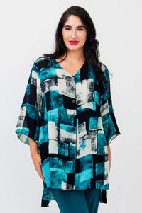 Front view of woman wearing a blue and black patterned Darla blouse with 3/4 sleeves