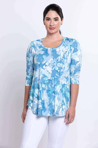 Front view of model wearing a blue watercolor print Jazz Top with 3/4 sleeves