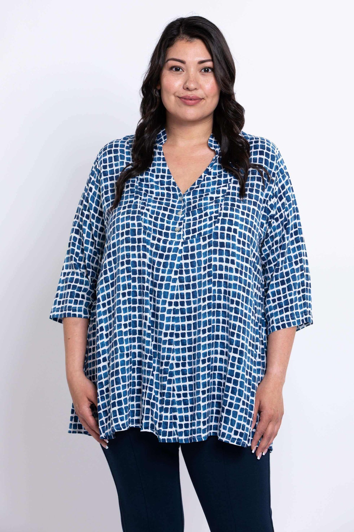 Front view of model wearing blue batik Shirley blouse with 3/4 sleeves