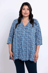 Front view of model wearing blue batik Shirley blouse with 3/4 sleeves