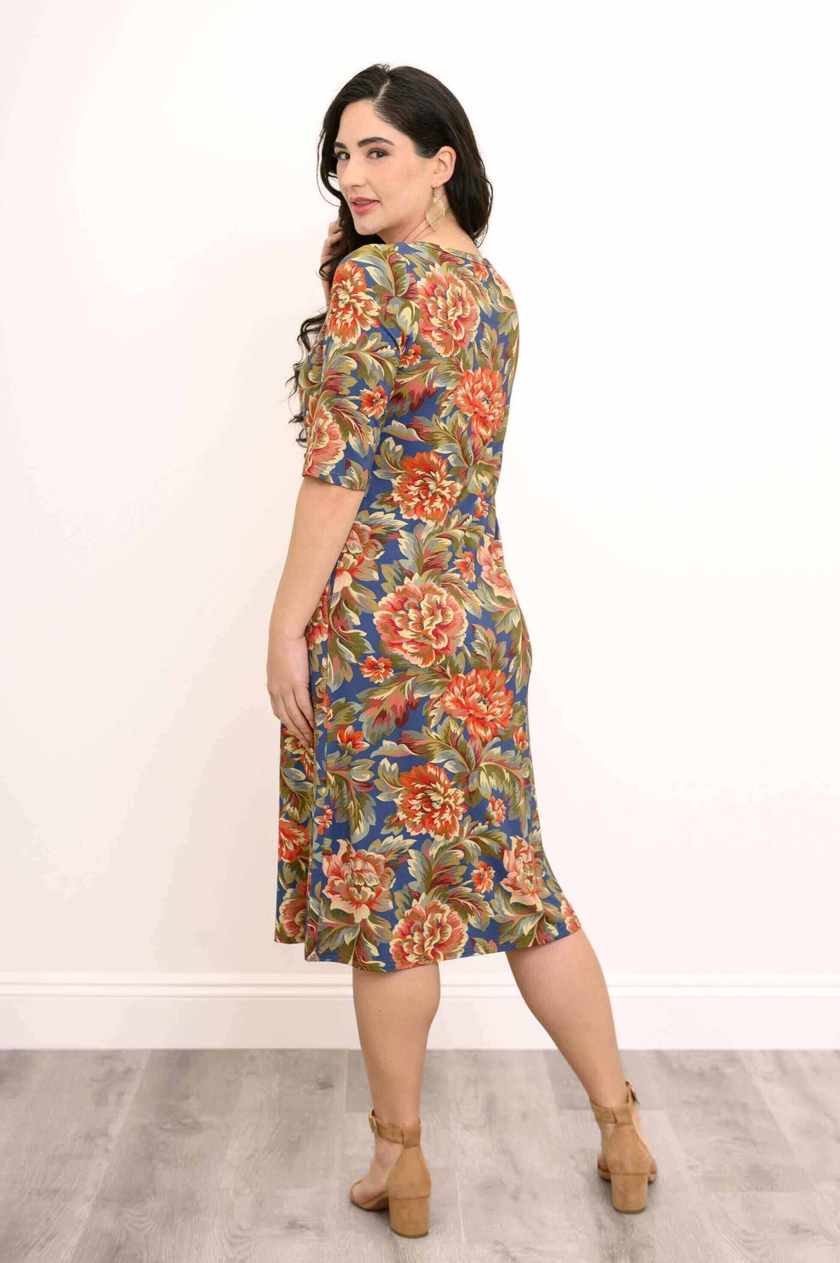 Rear view of woman in floral bamboo dress with 3/4 sleeves