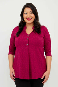 Front view of a woman wearing a raspberry V-neck bamboo top with three buttons and 3/4 sleeves