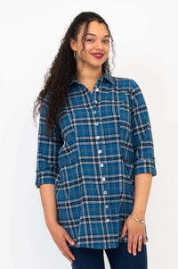 Woman posing in blue plaid flannel tunic with tabbed 3/4 sleeves