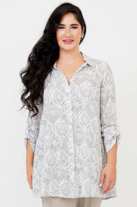 Woman wearing an oversized patterned bamboo-linen tunic with 3/4 tabbed sleeves, front view