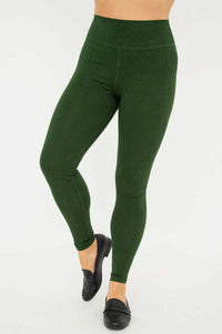 Three-quarter front view of Riley green leggings on model, highlighting fit and waistband