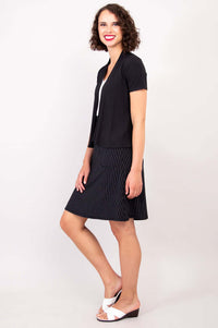 Angled side view of woman modeling black short sleeve open jacket