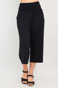 Angled view of black Gaylene capri pants showing relaxed fit