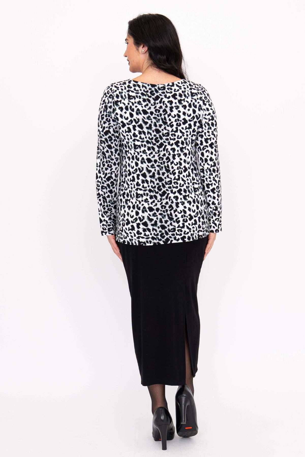 Back view of Annette long sleeve animal print top and black skirt