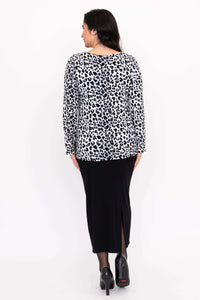 Back view of Annette long sleeve animal print top and black skirt