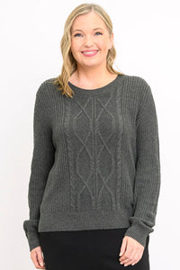 Front view of female model wearing a long-sleeve knit top in a dark ash tone with a rounded neckline, against a plain white backdrop.