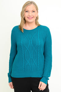 Front view of female model wearing long-sleeve knit top in a vibrant dark turquoise hue with a round neck, against a white backdrop.