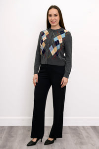 full body front view of woman in grey argyle cardigan with multicolor print