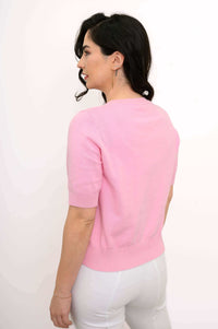 Back view of a pink short-sleeve cropped cotton cardigan