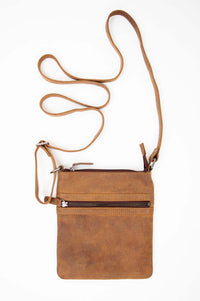 Back view of rustic brown leather crossbody pouch with zipper closure