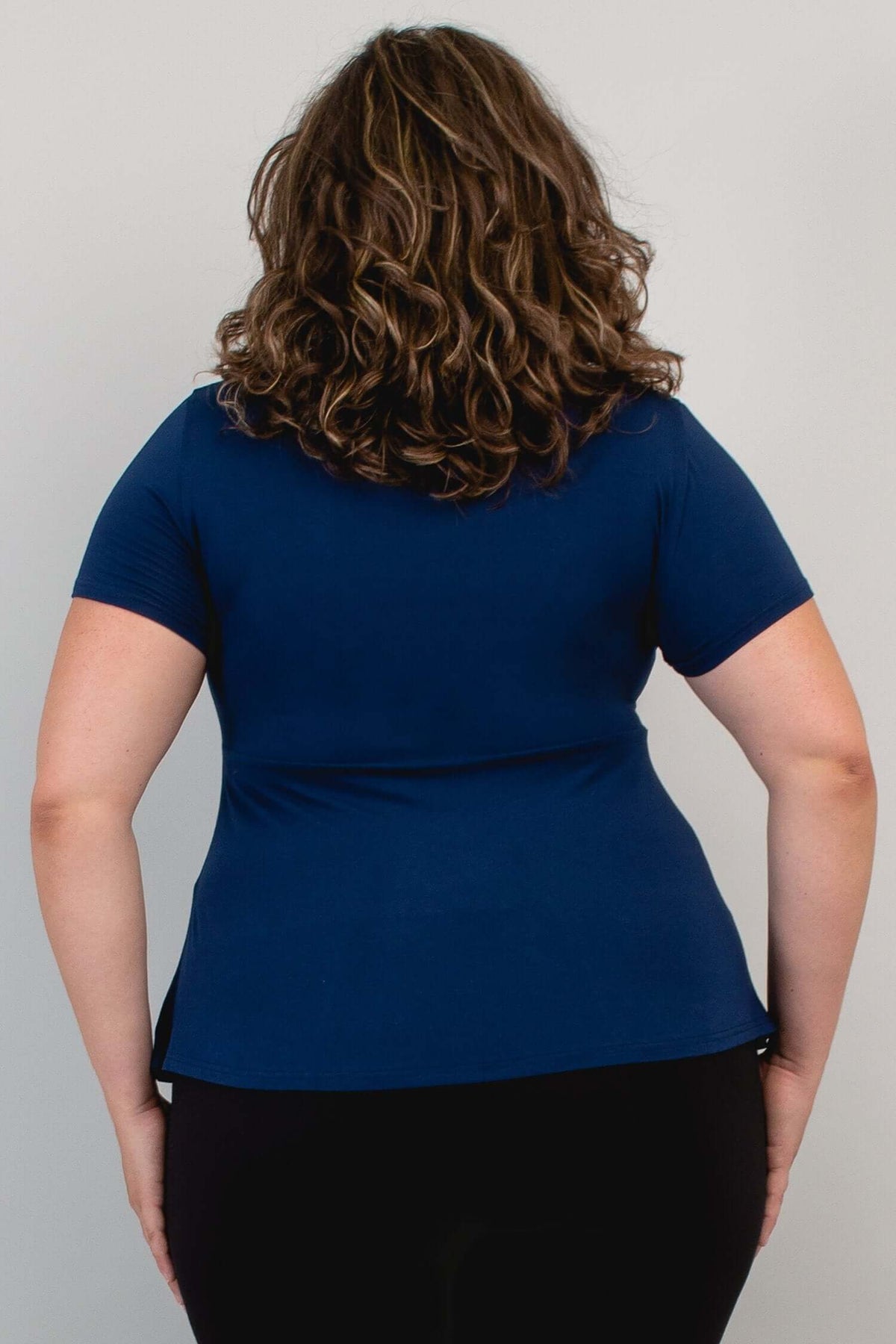 Back close-up of model wearing Kim Cap Top in navy
