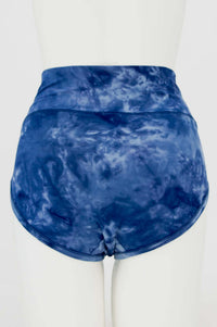 Back view of blue tie dye bamboo brief with seamless coverage on mannequin