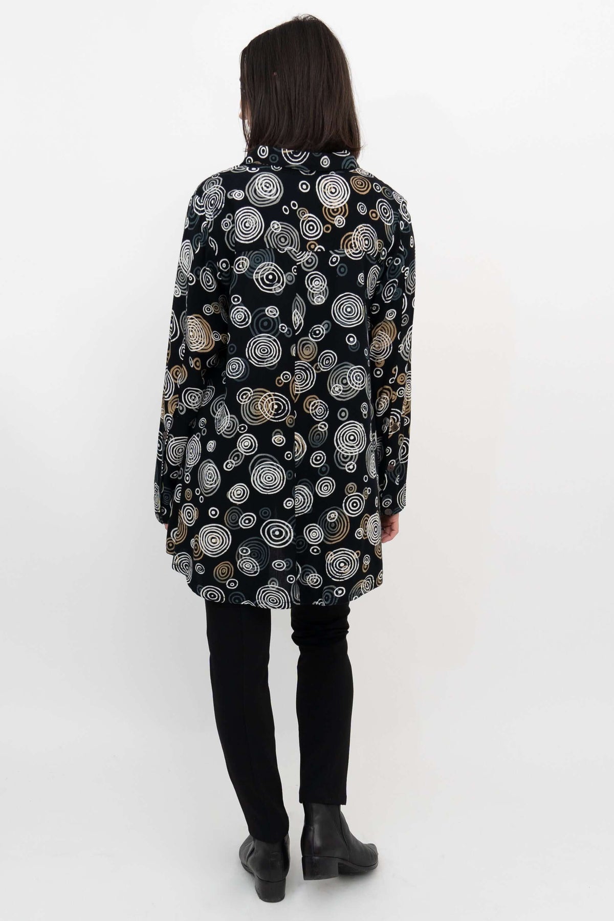 Back view of Stanley Blouse showcasing high-low hem and circular pattern