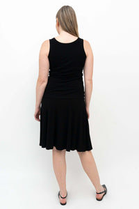 Back view of Aly fit and flare black skirt on model