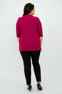 Back view of woman modeling raspberry V-neck bamboo top and black pants