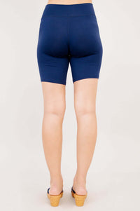 Back view of woman wearing navy Hallie Bamboo Shorts showing seamless design