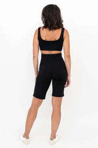 Back view of Leslie shorts worn by model in black crop top