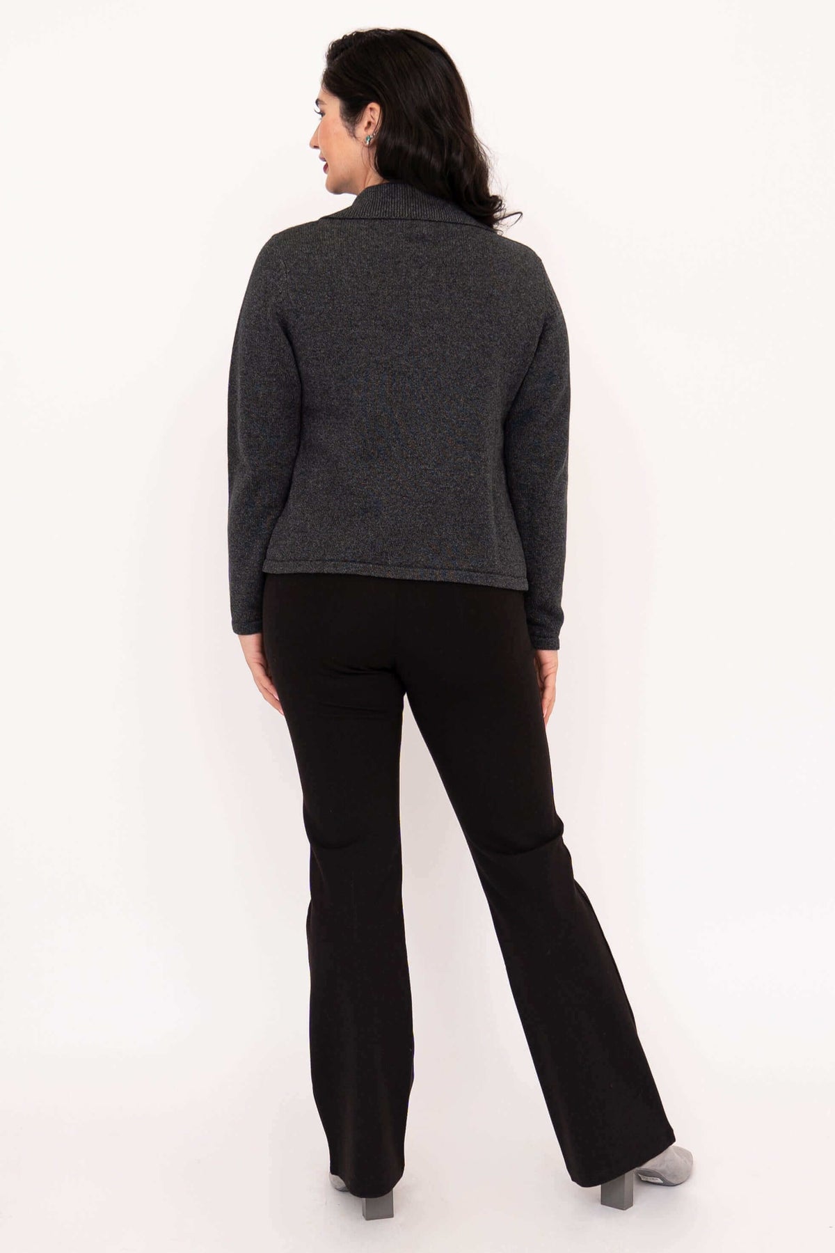 Back view of model in charcoal gray cardigan and black pants