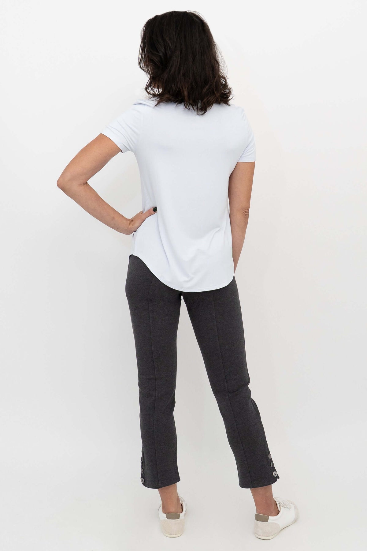 Back view of Nadine Crop Pants in charcoal grey, showing button detail at hem
