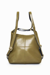 Back of olive green convertible shoulder bag with cross-stitch and adjustable straps