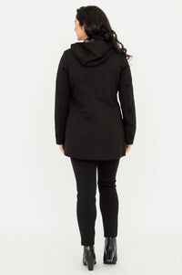 Back view of model wearing The Highlands Coat with hood down