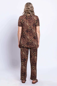 Back view of woman wearing leopard print bamboo lounge pants and matching top