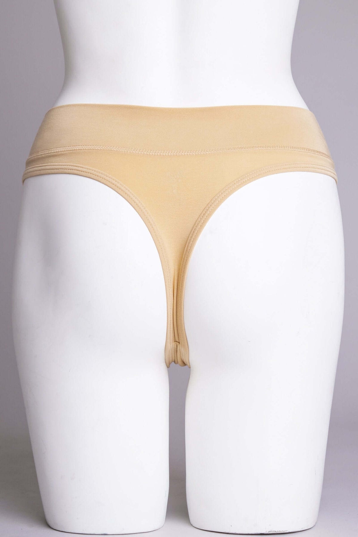 Rear view of beige high-rise bamboo thong underwear on a mannequin