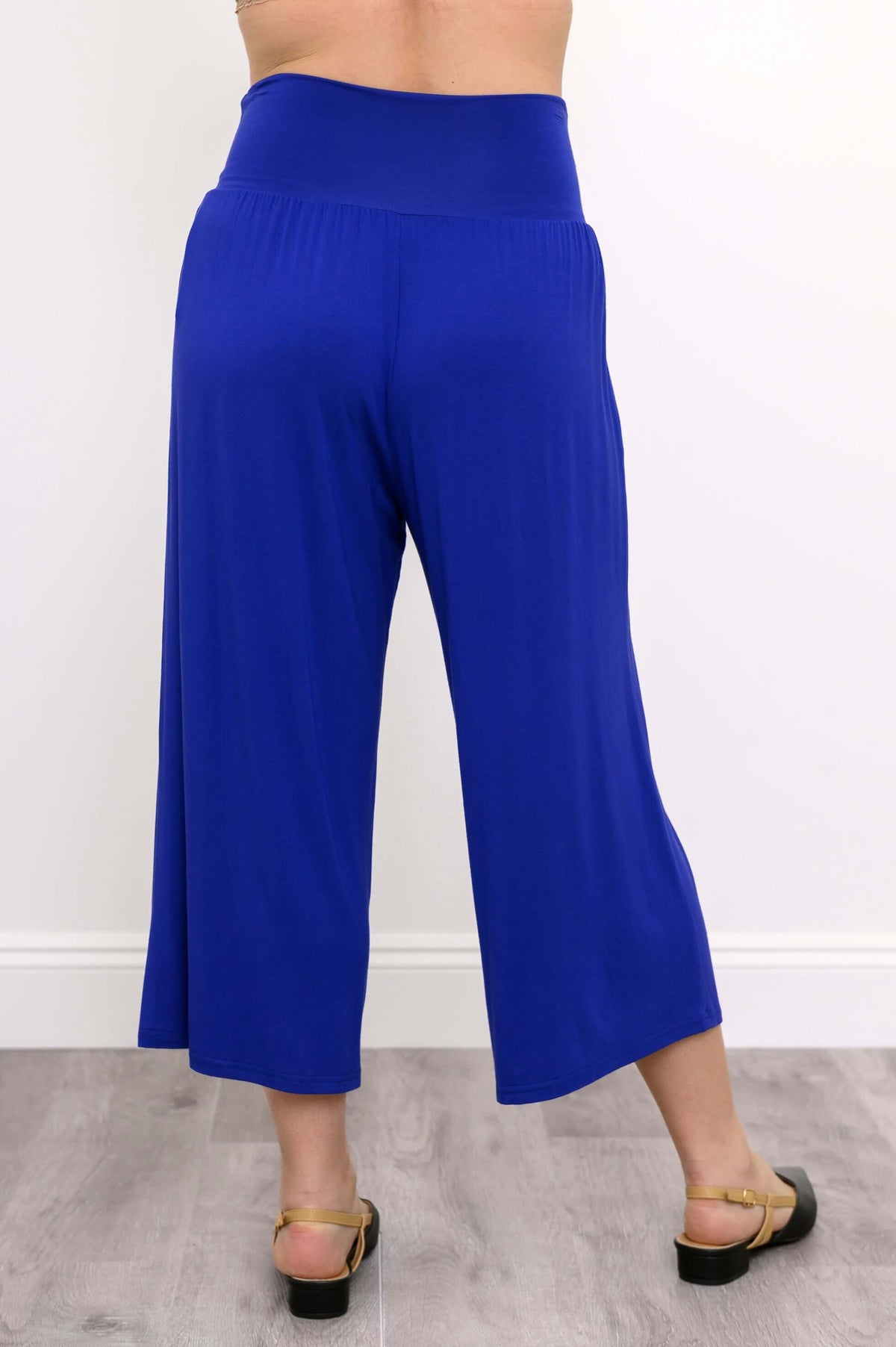 Back view of blue cropped palazzo capri pants with wide waistband