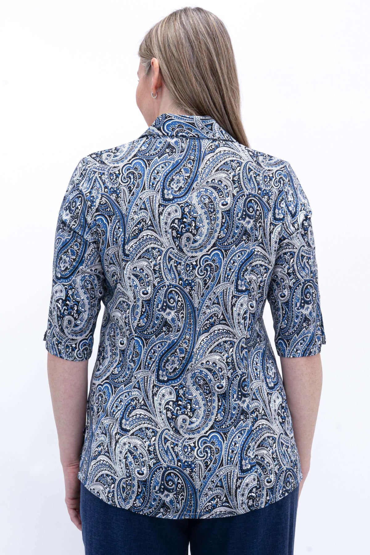 Back view of woman wearing blue paisley bamboo and linen blouse