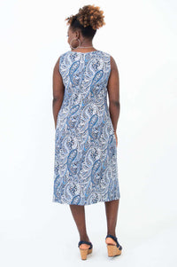 Back view of woman in blue paisley shift dress