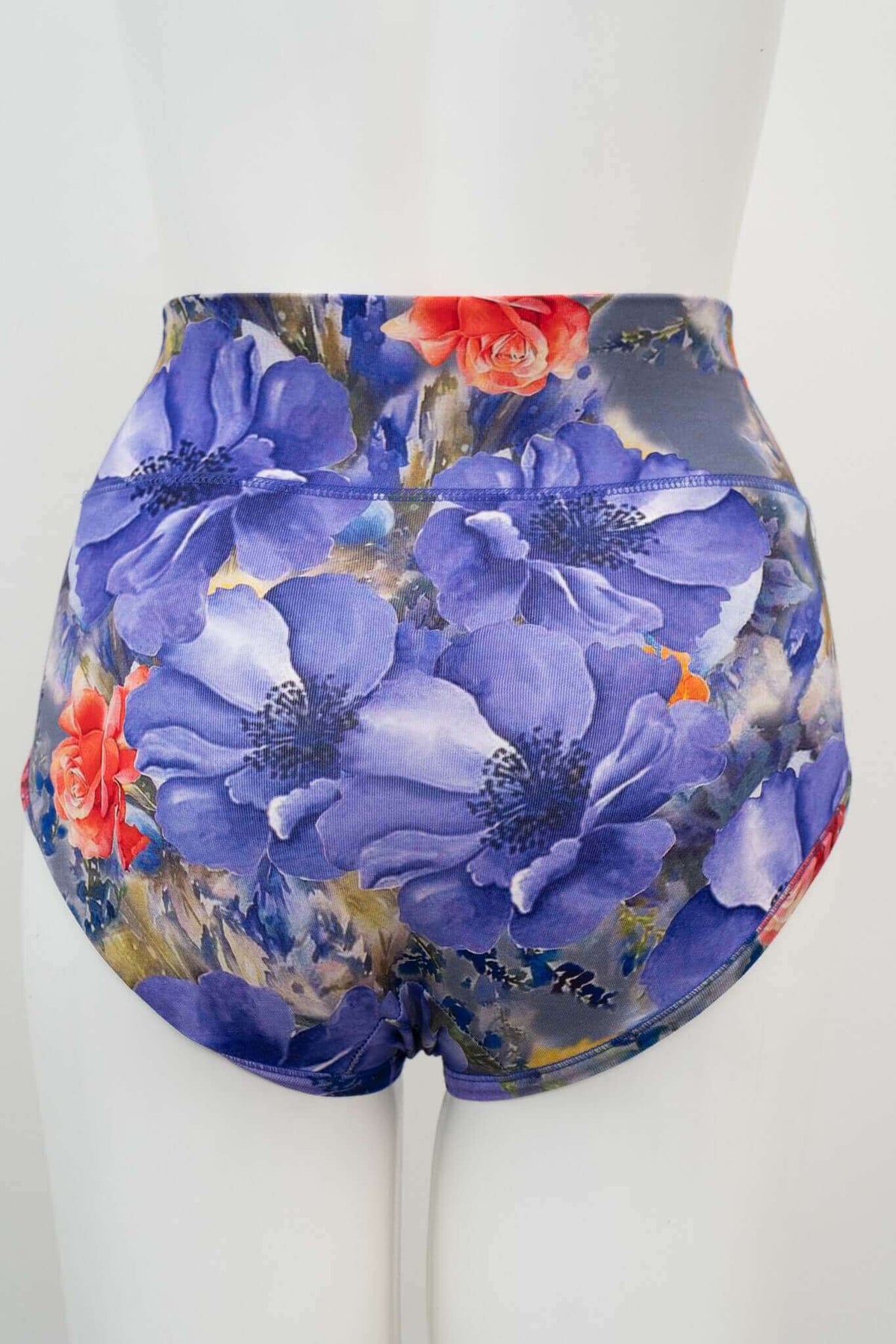 Back view of floral high-waist brief featuring large purple flowers on mannequin