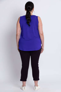 Back view of model wearing grape sleeveless tank top with long ponytail