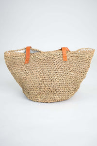 Back view of the hand woven rattan bag with leather handles