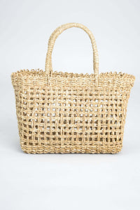 Back view of hand woven rattan basket with sturdy handles