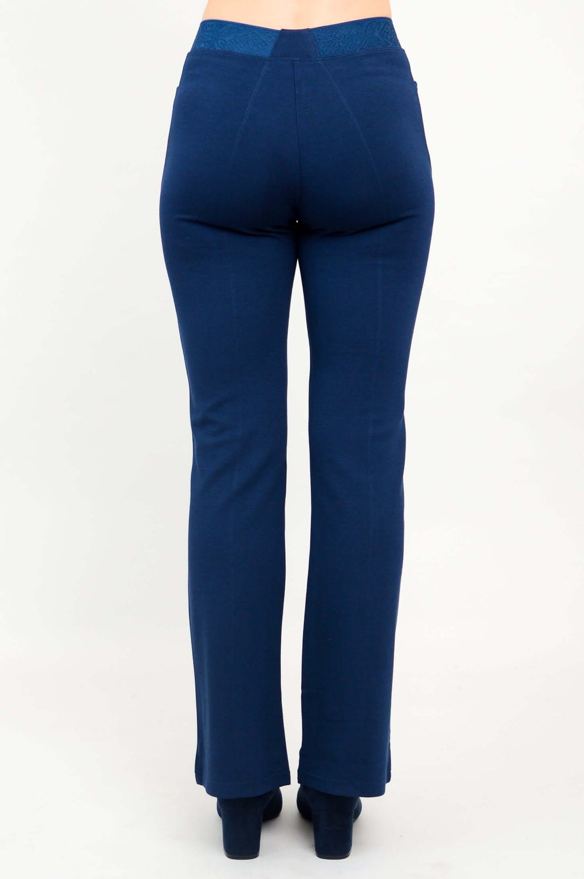 Back view of indigo flare modal pants highlighting waistband and seams