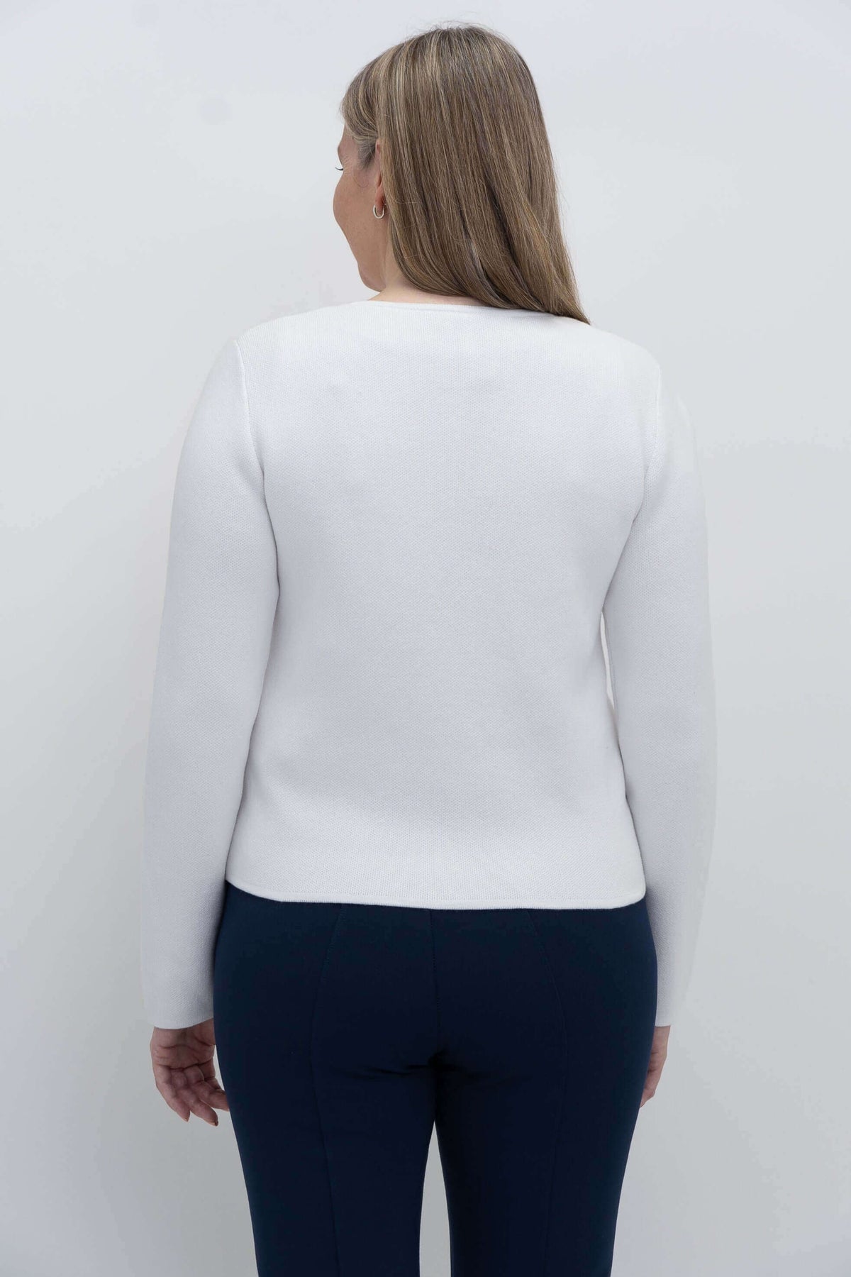 Back view of ivory cardigan on woman