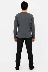 Rear view of man wearing charcoal V-neck long sleeve shirt and black pants