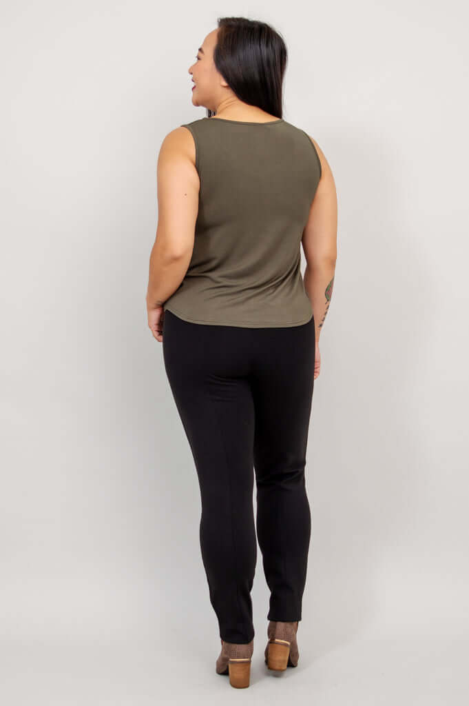 Back view of model wearing olive green Ritzy tank top and black pants